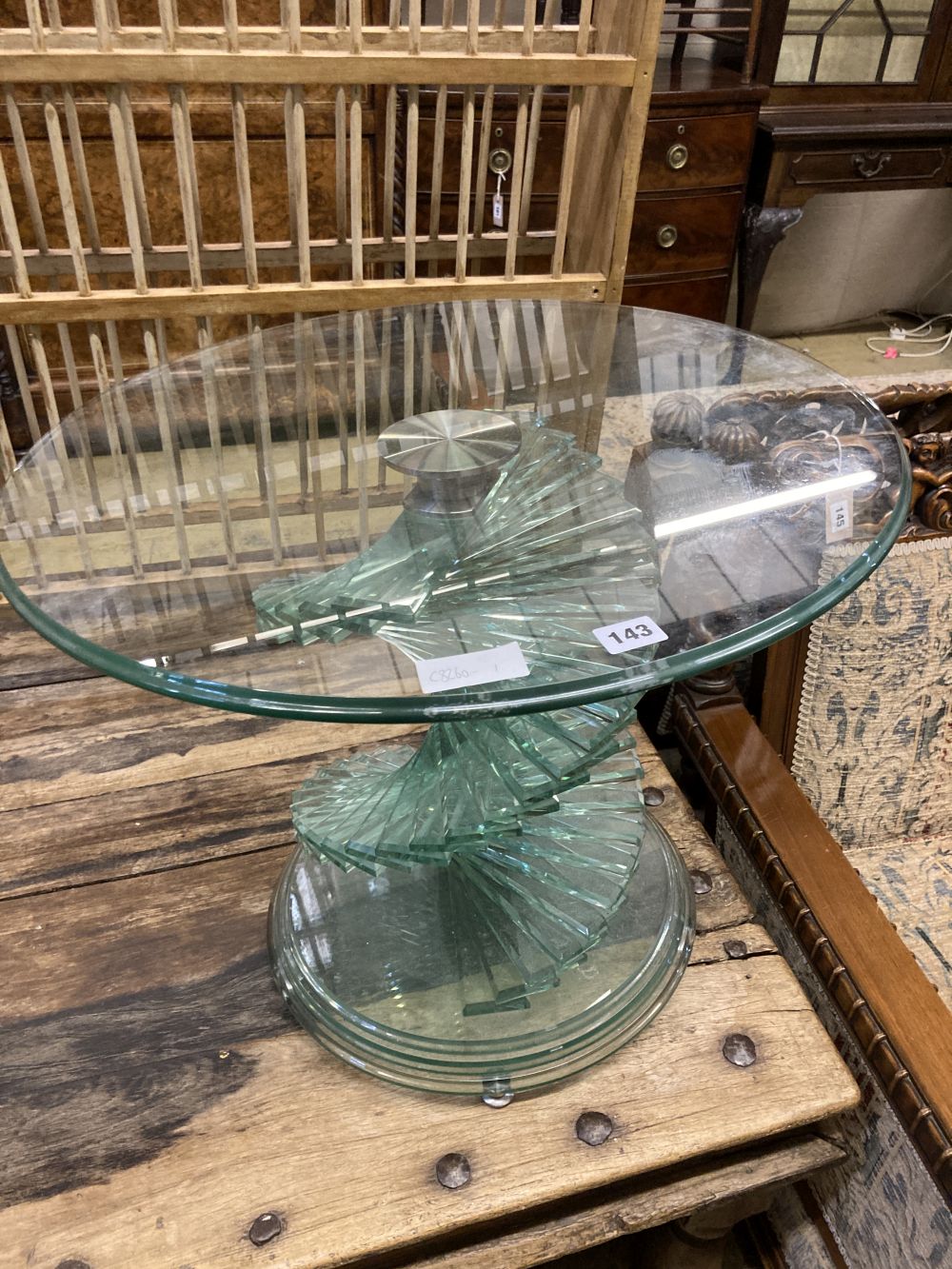 A contemporary circular glass occasional table, diameter 60cm height 50cm
